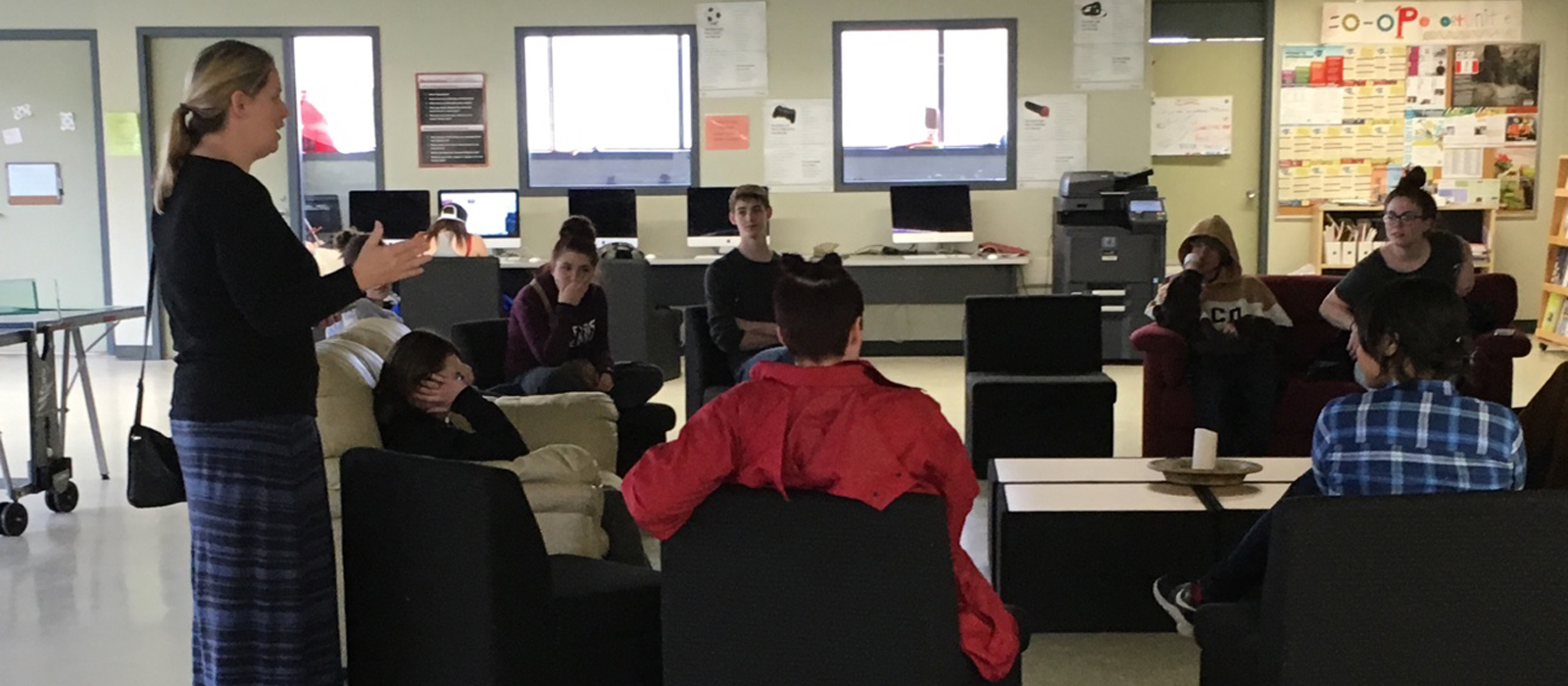 Female teacher talking to Students