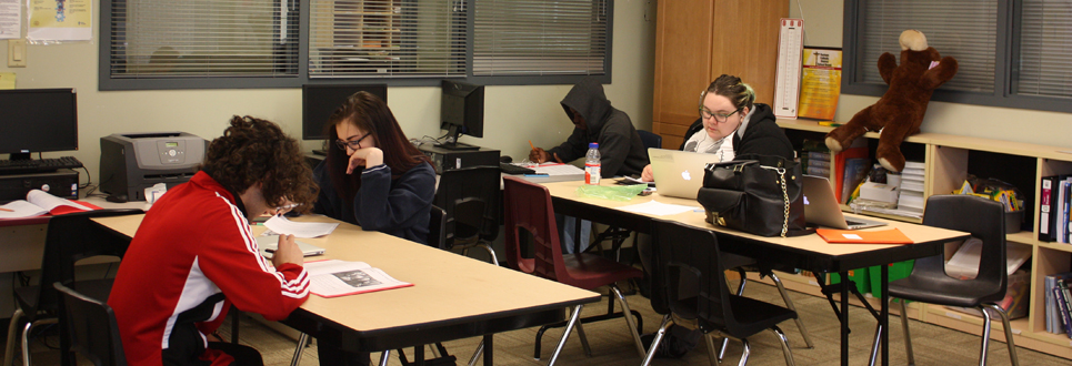 Students sitting at tables working 